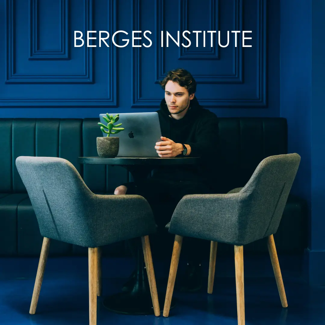 A man taking an online Spanish class with a laptop at a coffee shop